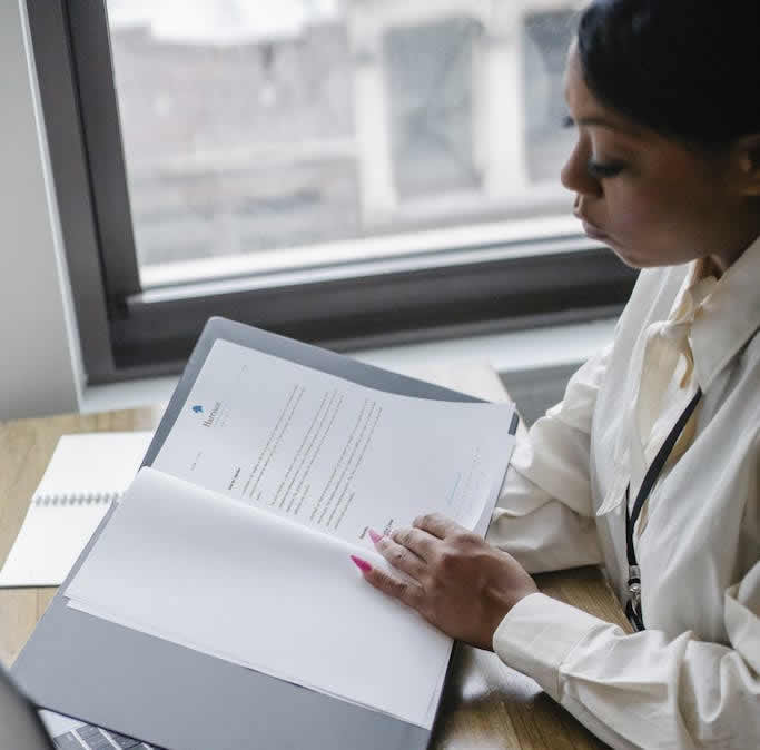 Black woman working with documents in office